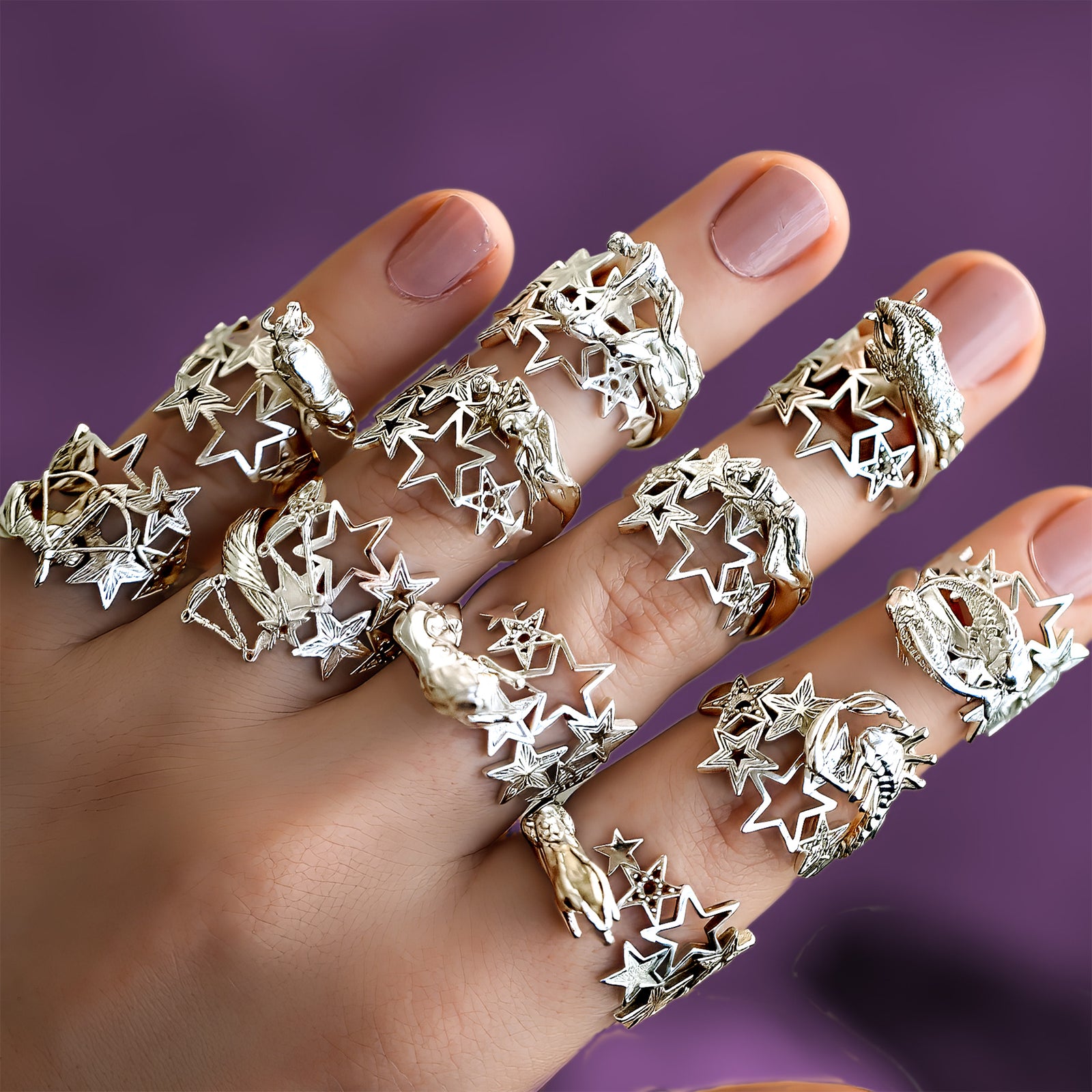 Woman's hand wearing stacked silver zodiac rings with star designs, birthday gift for her, CITIMI
